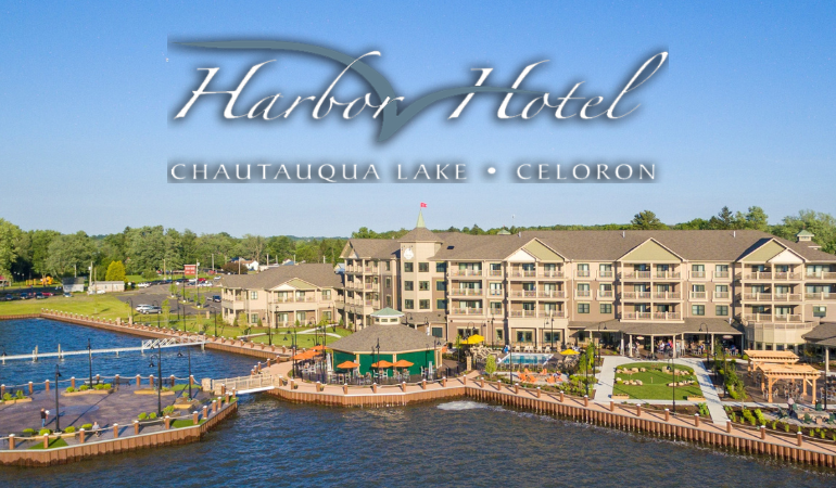 Exterior Image of the Chautauqua Harbor Hotel with logo overlay. Chautauqua Lake is pictured.